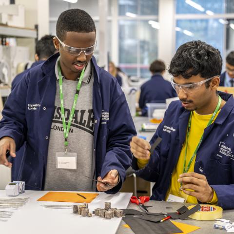 Two young men in the workshop during the Maker Challenge at the Invention Rooms