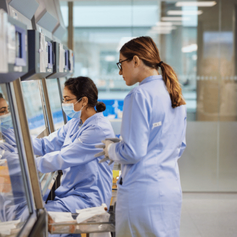 Two female researchers work in a laboratory at Autolus