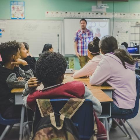 A teacher leads a secondary school class