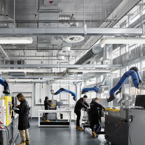 Students work in a lab at the Graphene Engineering Innovation Centre at the University of Manchester