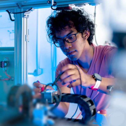 A student works in an electronics lab 