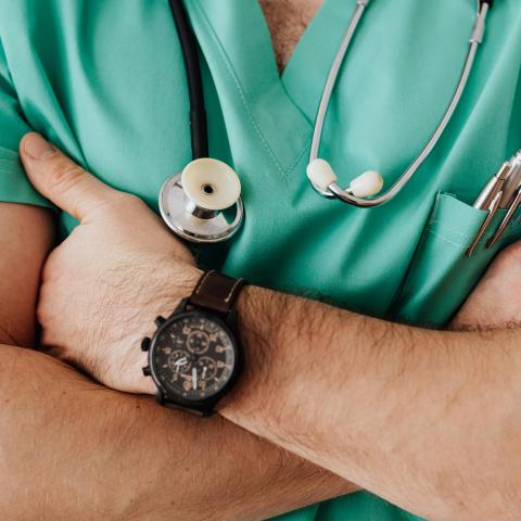 Crop unrecognizable doctor with stethoscope