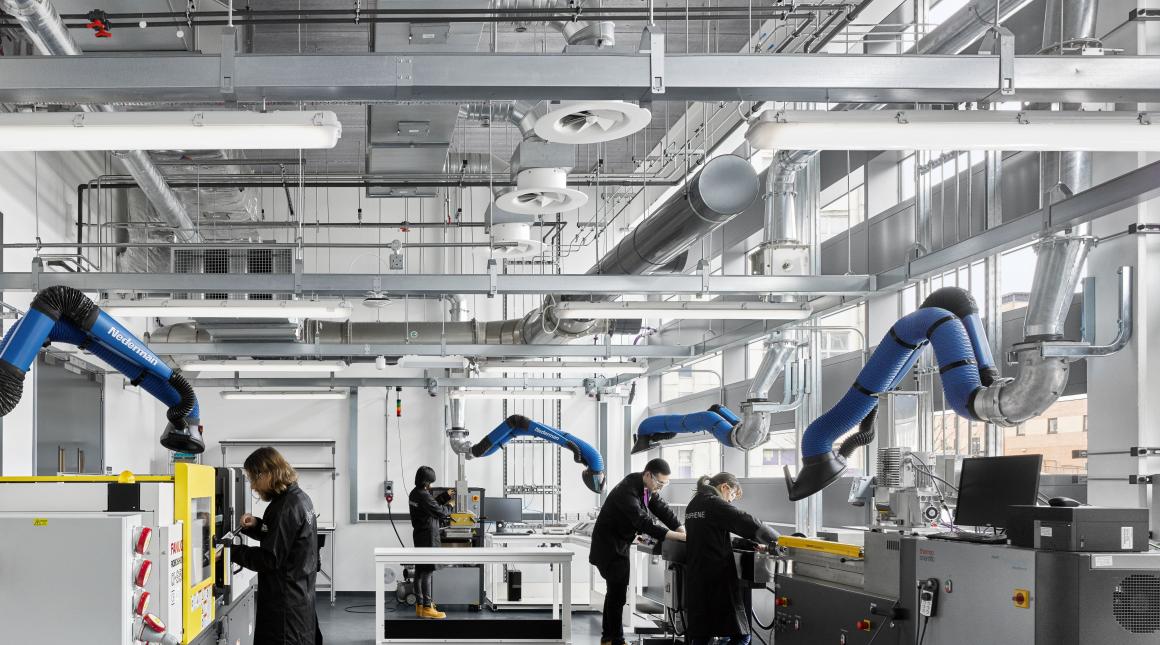 Students work in a lab at the Graphene Engineering Innovation Centre at the University of Manchester