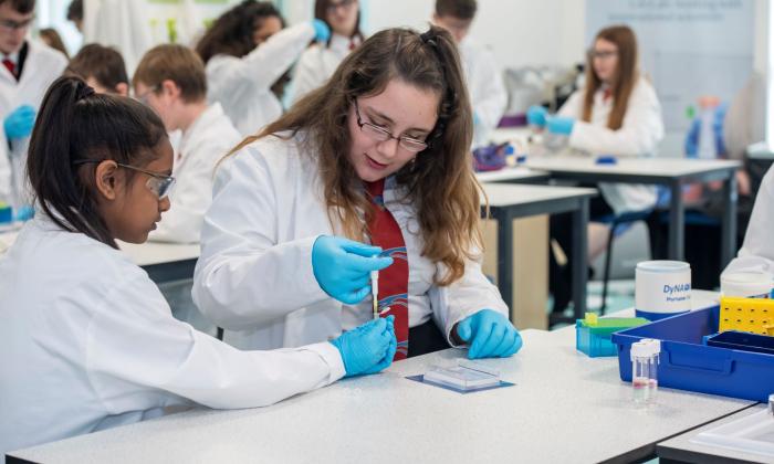 Two girls carry out an experiment in a lab in Southampton