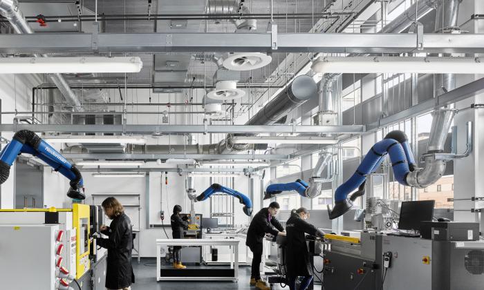 Students work in a lab at the Graphene Engineering Innovation Centre at the University of Manchester