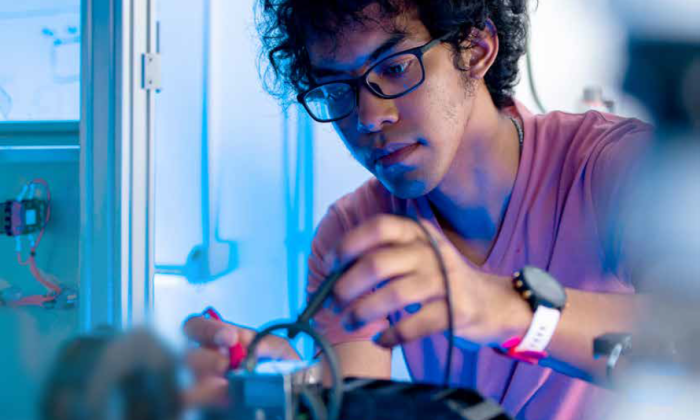 A student works in an electronics lab 