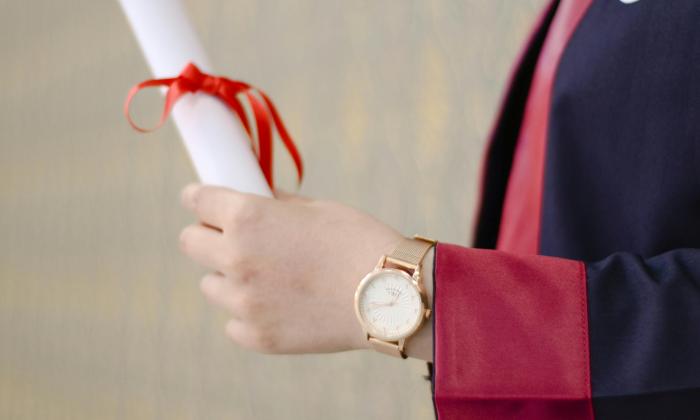 Person Holding Diploma