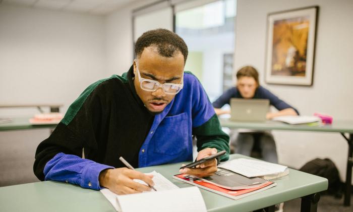 A mature student working in a classroom